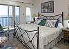 The bedrooms feature air-conditioning, sliding glass doors that let the views in, ample closet space and bureaus. Two bedrooms are located on the main level and have inside access; the third bedroom is located on the lower level of the house adjacent to the swimming pool. An abundant easterly ocean view can be seen from the comfortable master bedroom that features views of the pool deck, Great Cruz Bay harbor and the mountains beyond. The room is bathed in a palate of island blue, navy and white.