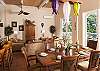 The dining table comfortably seats eight with the nearby extender. Open the French doors to enjoy the wonderful ocean breezes or relax in air-conditioned comfort. Step out onto the large covered deck and read your favorite book while overlooking the pool and gazebo area.