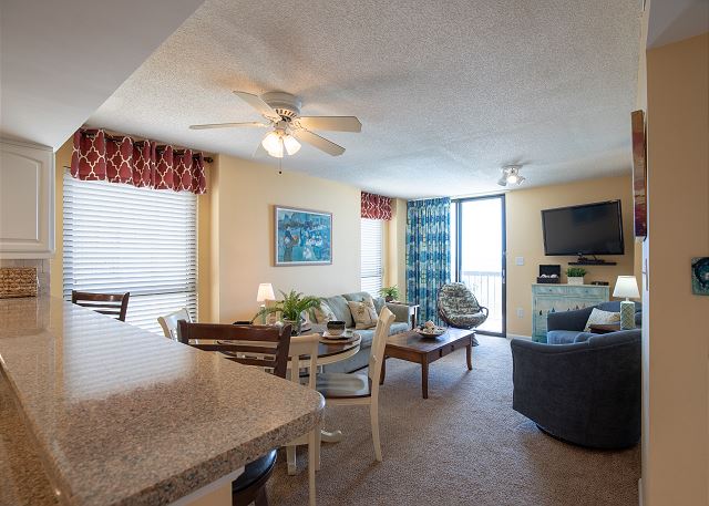 Living Room includes sofa (opens to Queen Sleeper) & 3 occasional chairs, flat screen TV, DVD player