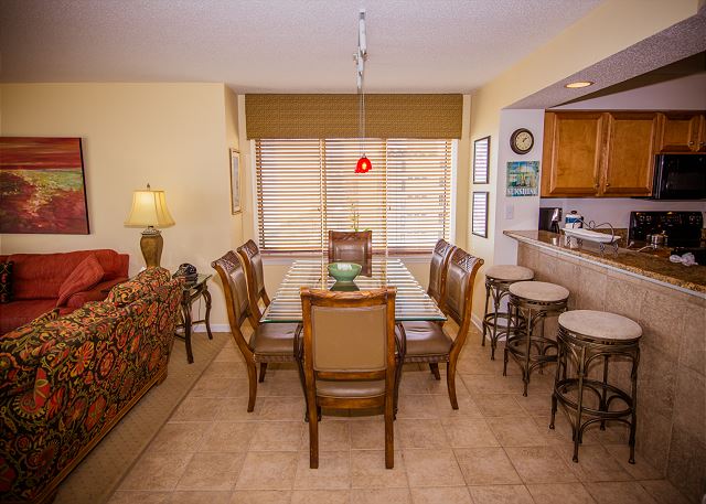 Bright end unit with spacious dining seating for 6 and breakfast bar to accommodate the whole family