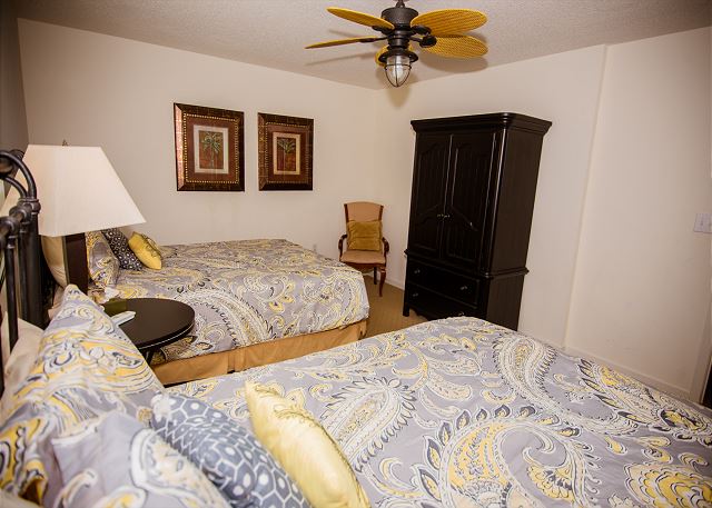Super guest room with two queen beds -- room for a whole family to stay.