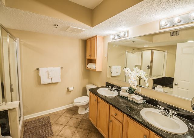 Enjoy this spacious master with double vanity. Your bath towels are included during your stay.