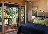 King bed with ocean views and sliding door to the lanai