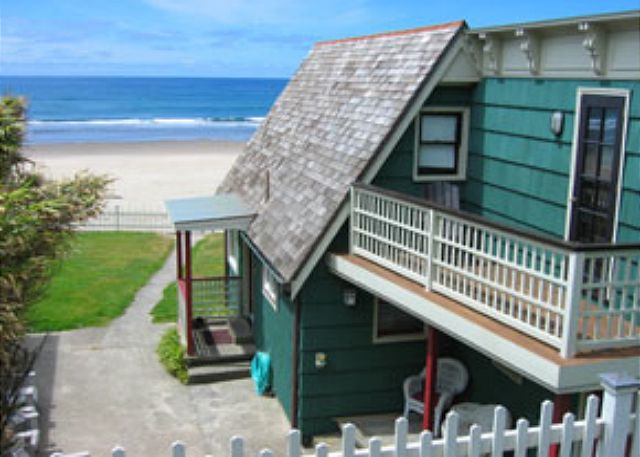 Image Patio has BBQ, 10 wooden adirondack chairs and a hot tub.