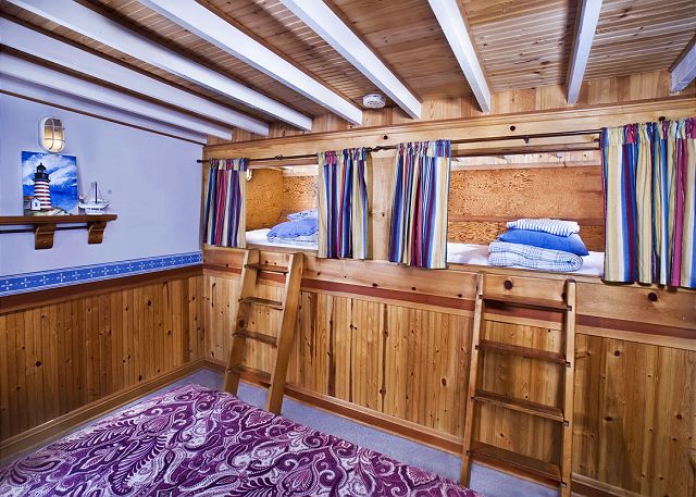 Image Queen bedroom has Kids Sleeping Loft with 2 twins. 