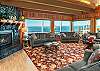 Image Large open living room with copper beamed ceilings.
