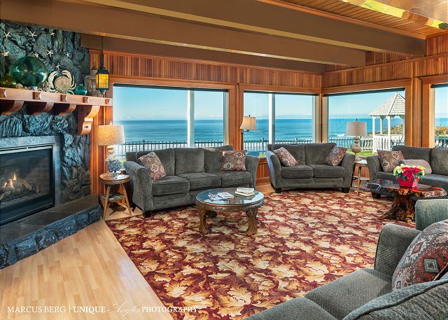 Image Large open living room with copper beamed ceilings.