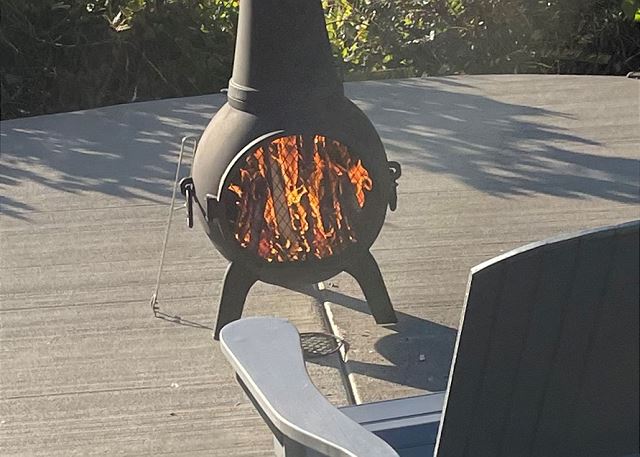 Image New pad and chimenea with lots of wooden chairs