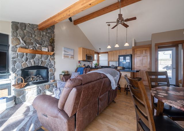 Image Living room showcasing river rock gas fireplace