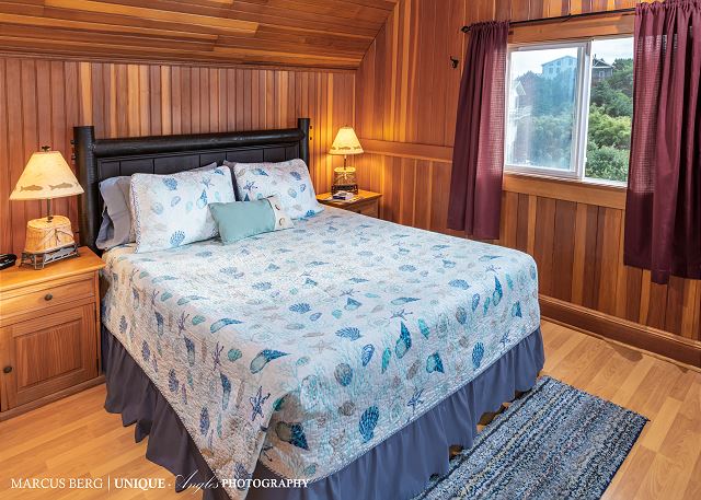 Image Upstairs Queen bedroom has views of the ocean