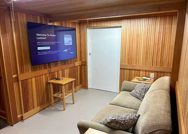 Image game room with 65 inch Roku