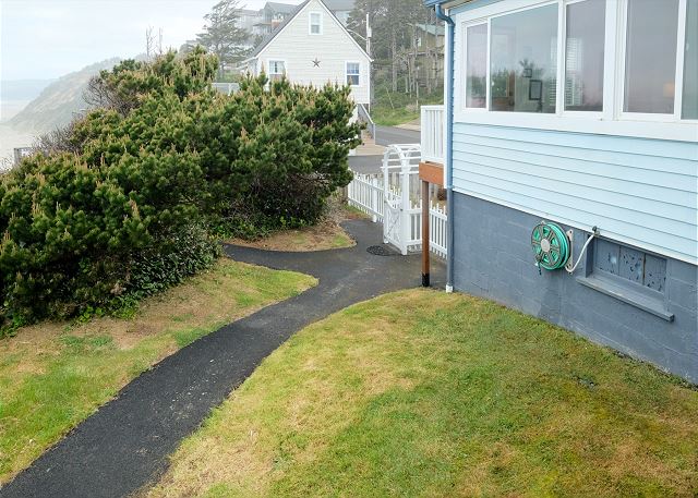 Image Private oceanfront yard with path to beach stairs