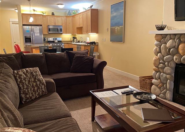 Image Living room with river rock gas fireplace