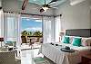 Private third floor master suite with king bed and stunning ocean view.