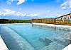 Gorgeous, shared, infinity pool on the roof.  Looking toward the lush mangrove forest.