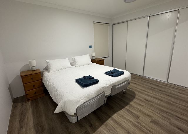 Plega Queen size bed. Split in two with one side being an electric lift bed that allows a person to lift the top or bottom of the bed as required