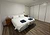 Plega Queen size bed. Split in two with one side being an electric lift bed that allows a person to lift the top or bottom of the bed as required