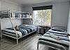 Third bedroom with bunk bed with double and single and a single bed to sleep 4