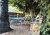 Shaded outdoor BBQ seating area