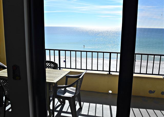 Step out onto this Gulf front and huge balcony from this master bedroom.