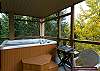The upper deck has great views of trees and mountains. This home has a high quality Beachcomber hot tub and BBQ.