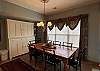 The dining table provides comfortable seating for 6-8 guests.