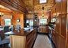 The large kitchen island provides space for meal prepping and/or extra dining space for 3-4 guests.