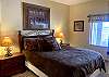 The master bedroom is located on the main level. It has a queen size bed, TV and a private bathroom.