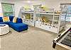 The 4th bedroom features two sets of twin bunk beds.