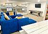 The 4th bedroom was designed with kids in mind. Highlights of this room include a Smart TV, shuffleboard table, a variety of board games, and a huge sectional couch.