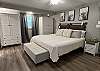 The primary bedroom features a king bed with adjustable bed frame. It has access to a private attached bathroom and access to a jack-and-jill bathroom.