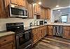 The kitchen is large and offers plenty of countertop space to prepare meals for a crowd.