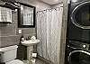The 3rd bathroom is located in the hallway and is shared among bedrooms 2 & 3. This bathroom houses the stackable washer/dryer set.