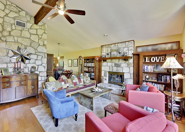 Main sitting room with a fantastic fire place and view of the front yard