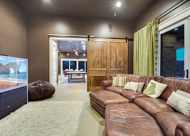 Enjoy a movie with the family or play Xbox with this amazing theater room