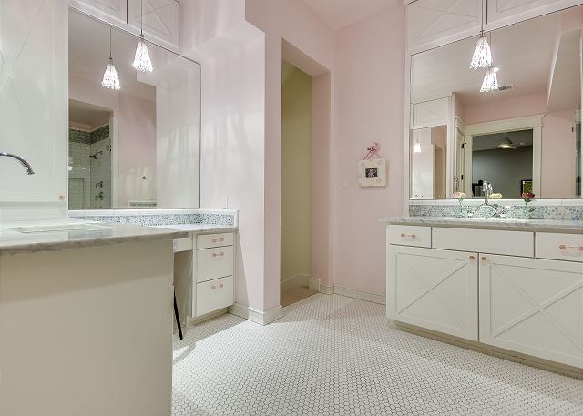 An expansive master bathroom connected to the Queen Master on the Main Level