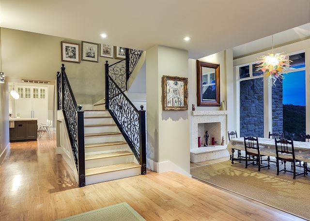 Stairs going up to the master bedroom & hallway going to the main living area