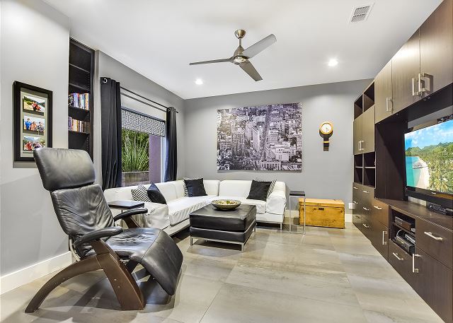 Enjoy this cleverly designed media room with just enough privacy.