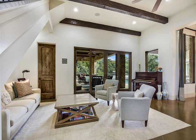 Another seating/lounging area in the living room with easy access to the pool