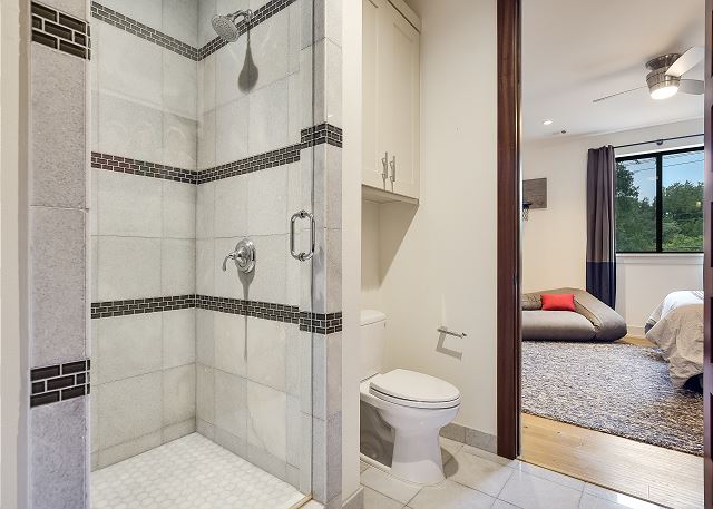 Full bathroom attached to a bedroom.