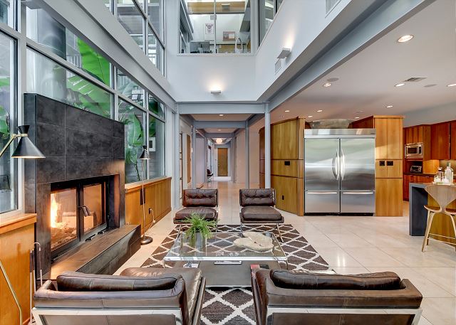 Spacious living area with indoor/outdoor fireplace