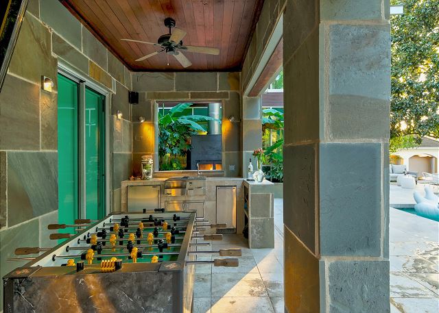 Grill out and play a round of foosball in this outdoor kitchen area
