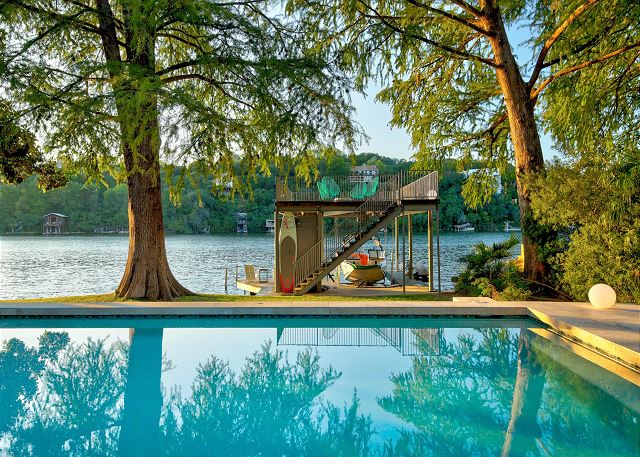 Gorgeous summer days are meant to be spent in this pool and on the upper level dock soaking in the sun