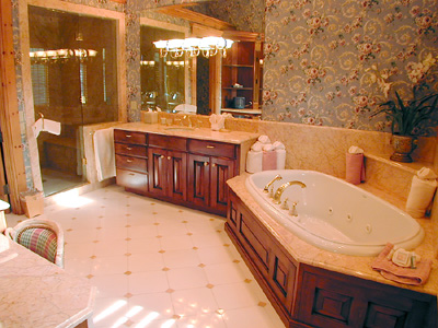 Master Bathroom with tub and vanities. 