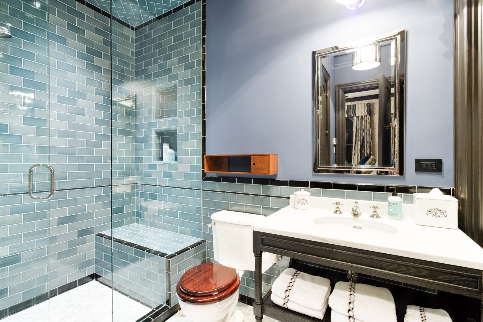 Bathroom with walk-in, sit down shower. 