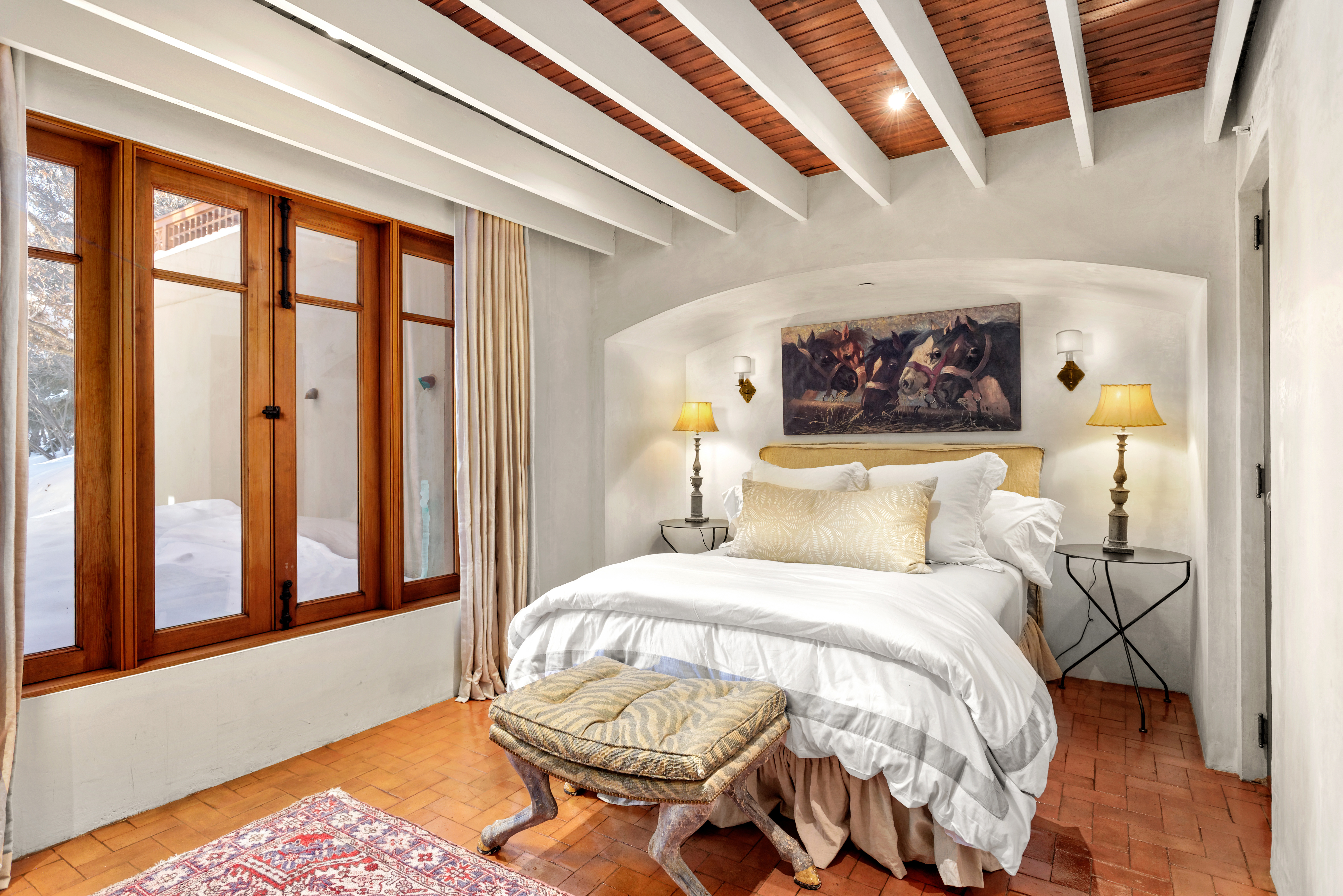 Guest Bedroom with high ceilings and Queen sized bed. 