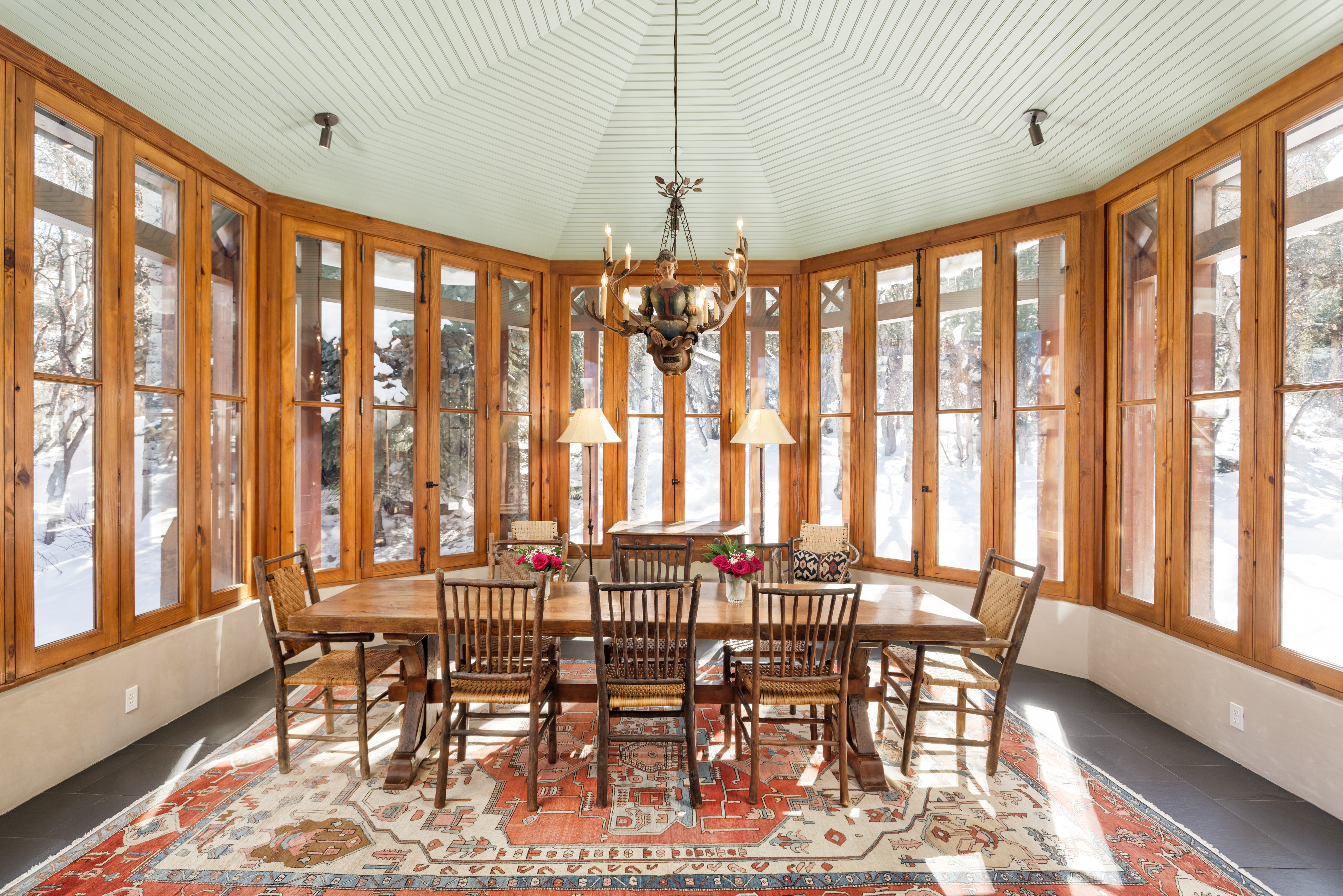 Dining room with wrap around windows. 