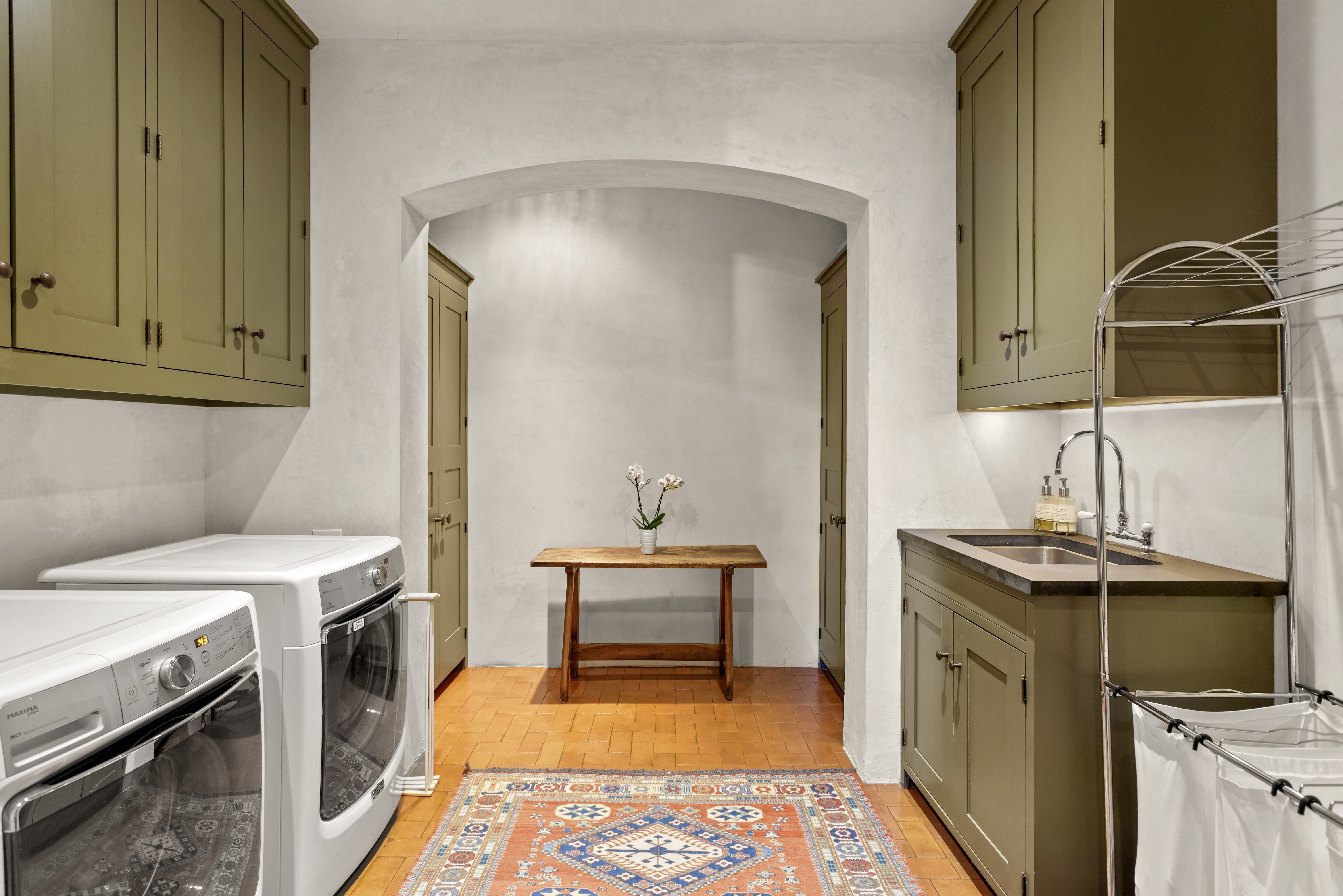 Laundry room with storage. 