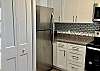 Inside the closet doors in kitchen are the stackable washer and dryer.  Great for washing bathing suits and towels as needed.