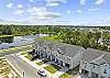 Aerial of townhome with wonderful nature pond 